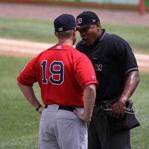 Photo of an ump and coach arguing